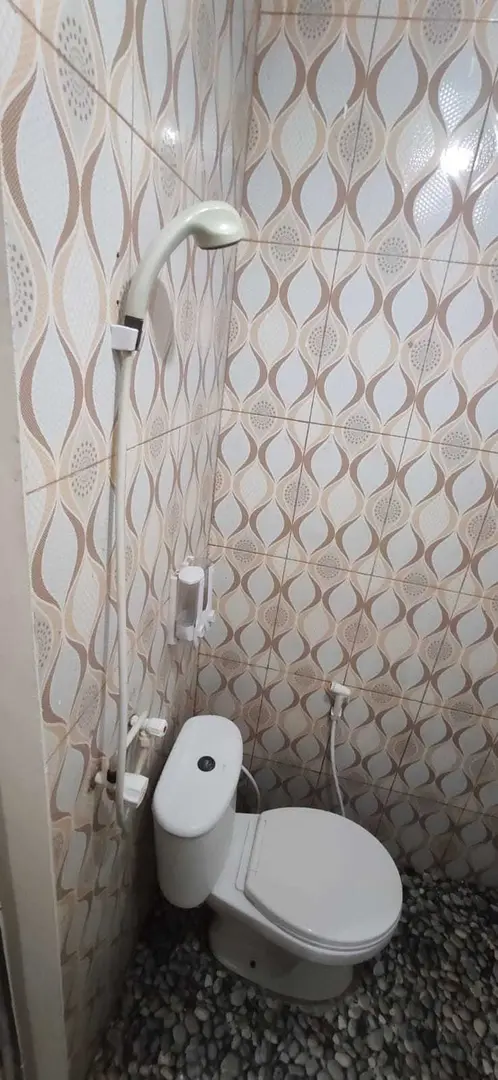 foto kamar Tipe Deluxe properti Behomy Cozynest AA4