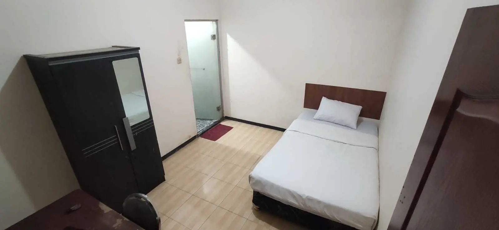 foto kamar Tipe Deluxe properti Behomy Cozynest AA4